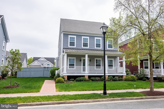 view of front of property with a porch and a front lawn