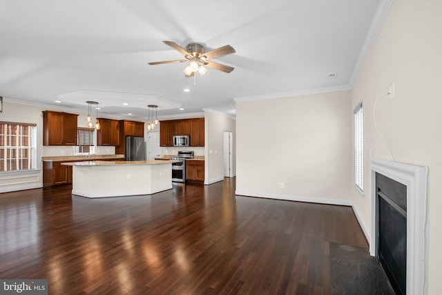 unfurnished living room featuring ceiling fan, dark hardwood / wood-style floors, and ornamental molding