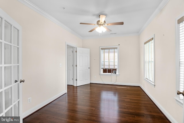 spare room with ornamental molding, ceiling fan, and dark hardwood / wood-style flooring