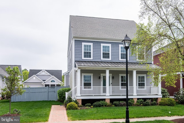 view of front facade with a front lawn and a porch