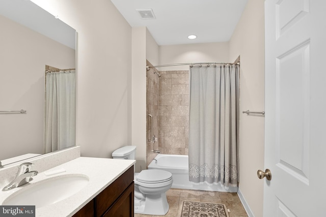 full bathroom featuring vanity, toilet, and shower / tub combo