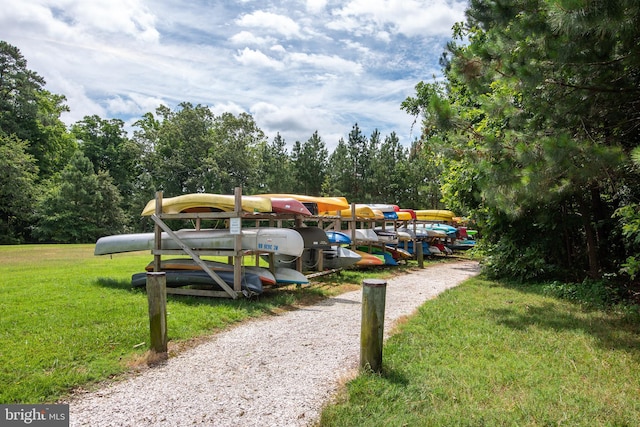 view of home's community with a yard