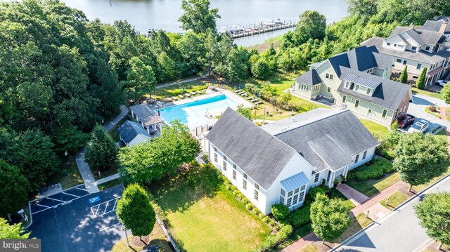 birds eye view of property with a water view