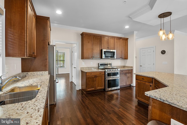 kitchen featuring crown molding, sink, pendant lighting, stainless steel appliances, and light stone counters