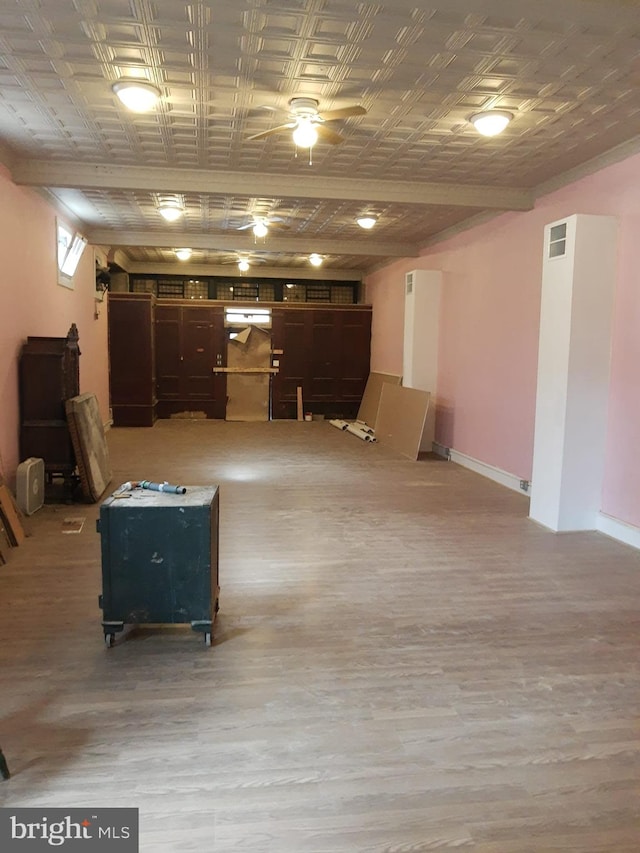 basement featuring light hardwood / wood-style floors