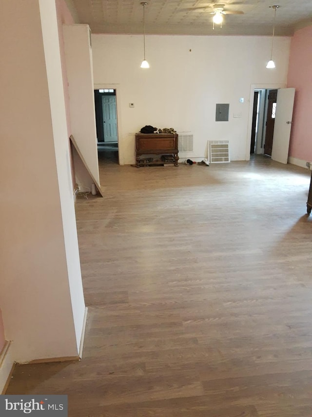 empty room featuring ceiling fan and hardwood / wood-style floors