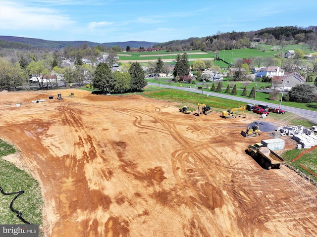 birds eye view of property featuring a mountain view