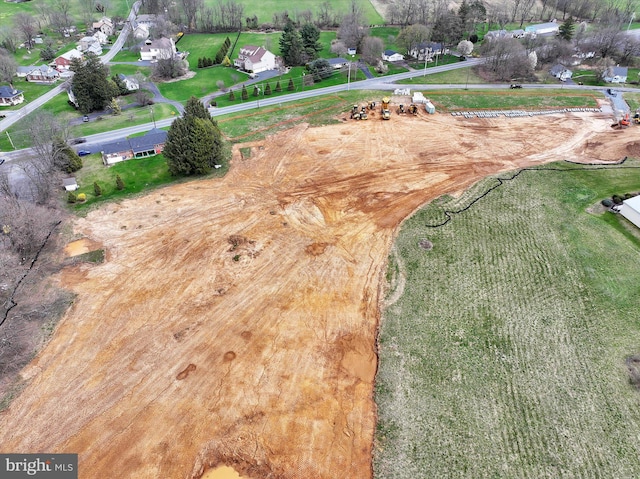 birds eye view of property with a rural view