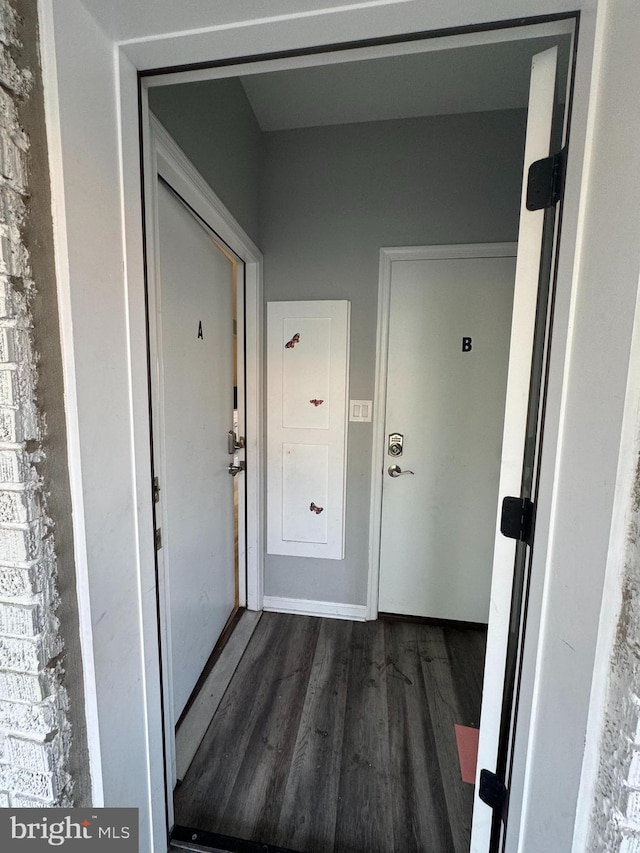 hallway with dark hardwood / wood-style floors