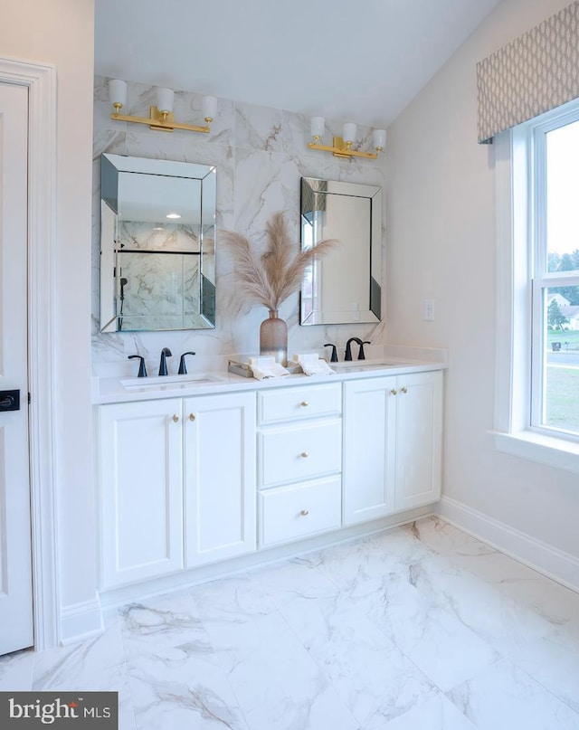 bathroom featuring backsplash, tile floors, and dual bowl vanity