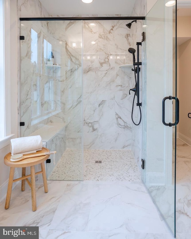 bathroom with tile flooring and walk in shower