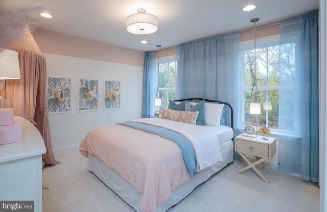 bedroom featuring light carpet