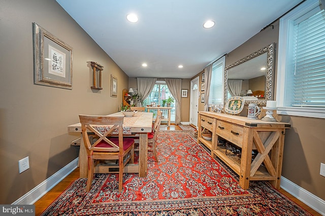 dining room with dark wood-type flooring