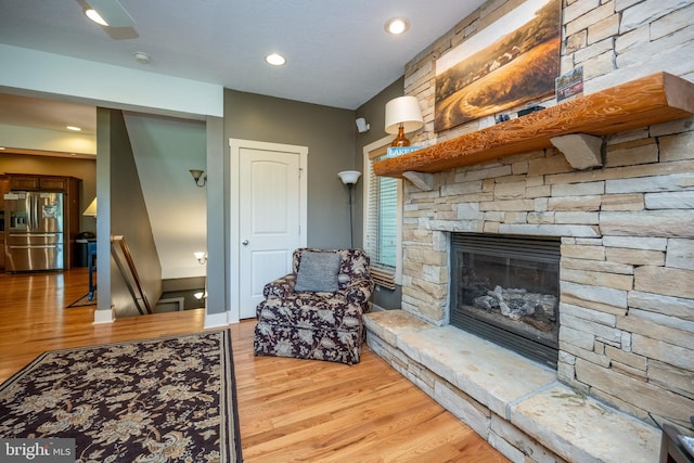 living room featuring a fireplace and hardwood / wood-style floors