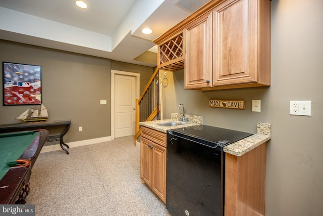 kitchen featuring light colored carpet, sink, billiards, and light stone counters