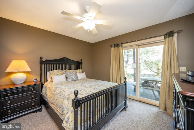 carpeted bedroom with ceiling fan and access to exterior