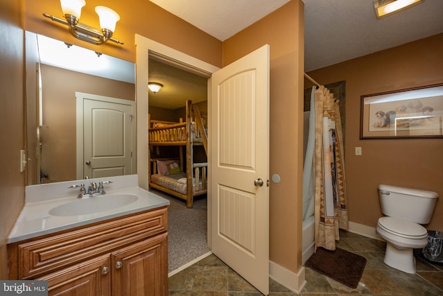 full bathroom featuring vanity with extensive cabinet space, toilet, tile flooring, and shower / tub combo with curtain