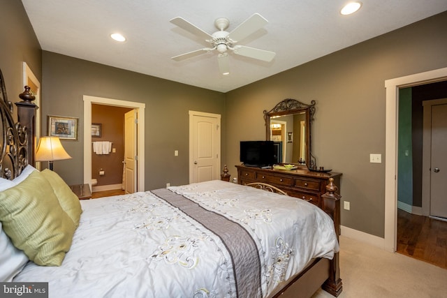 bedroom with ceiling fan and hardwood / wood-style flooring