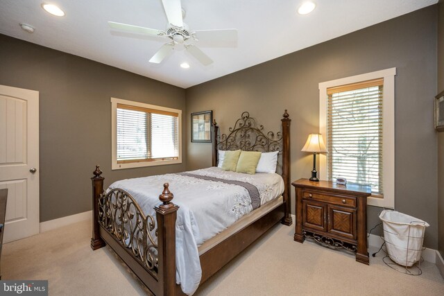 carpeted bedroom featuring ceiling fan