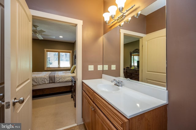 bathroom with ceiling fan and vanity