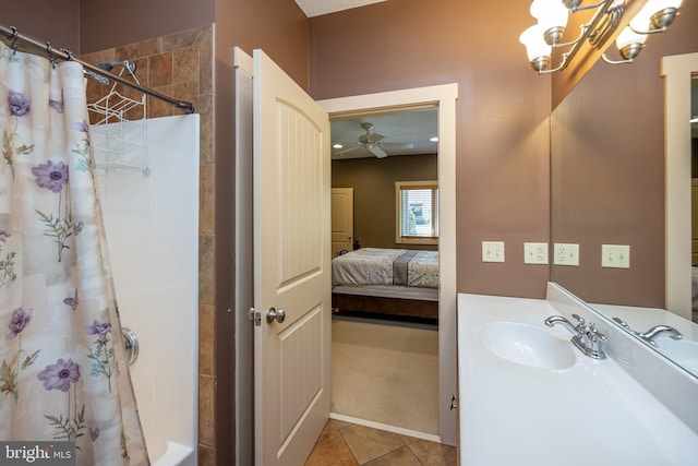 bathroom with ceiling fan, tile floors, and vanity