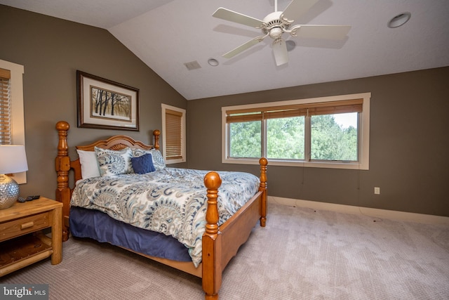 carpeted bedroom with vaulted ceiling and ceiling fan