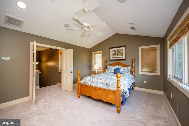 bedroom featuring lofted ceiling, ceiling fan, and carpet flooring