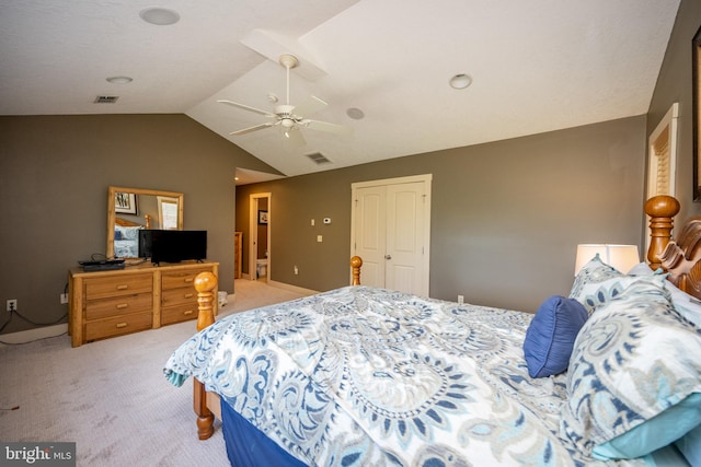 carpeted bedroom featuring vaulted ceiling, ceiling fan, and a closet