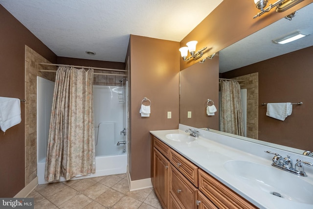 bathroom featuring shower / tub combo, large vanity, tile flooring, dual sinks, and a textured ceiling