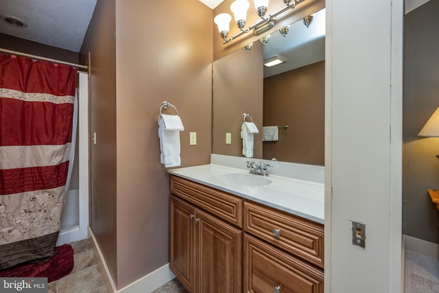 bathroom featuring tile floors and oversized vanity