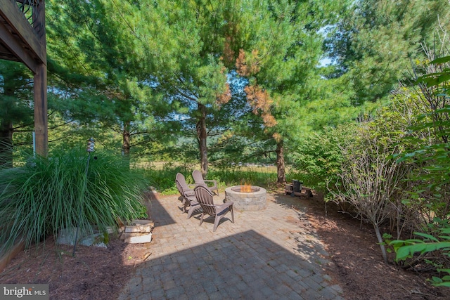 view of patio / terrace with a fire pit