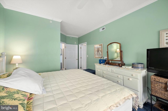 bedroom with ceiling fan and crown molding