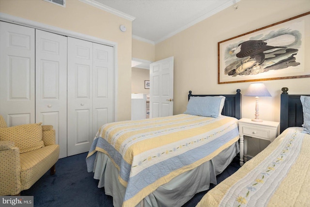 carpeted bedroom featuring a closet and crown molding