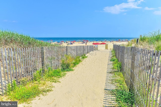 property view of water featuring a beach view