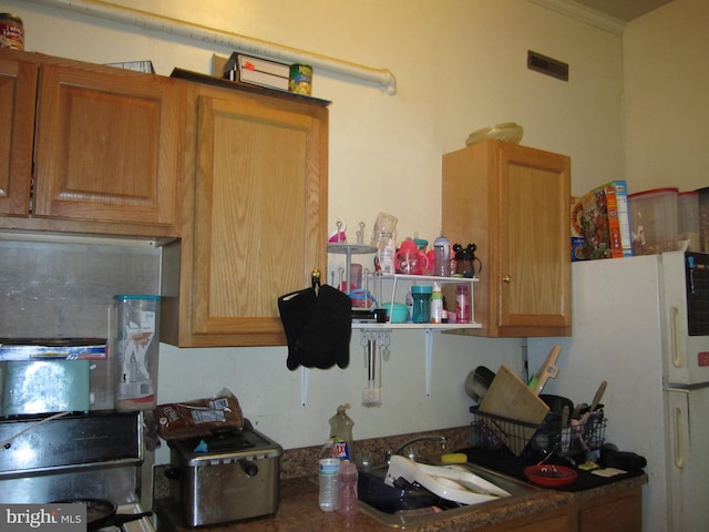 kitchen with white fridge and sink