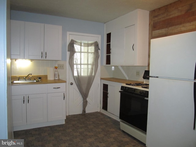 kitchen with butcher block counters, sink, white appliances, decorative backsplash, and white cabinets