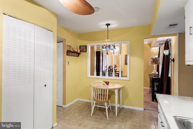 tiled dining area with sink