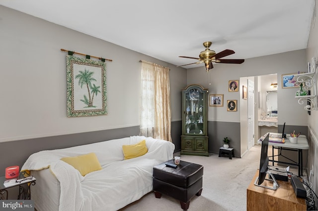 carpeted living room featuring ceiling fan