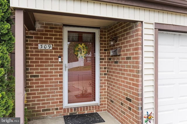 property entrance with a garage