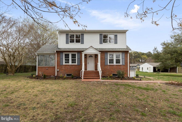 front facade with a front lawn