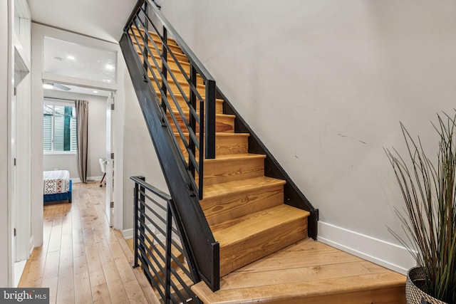 stairs with light wood-type flooring