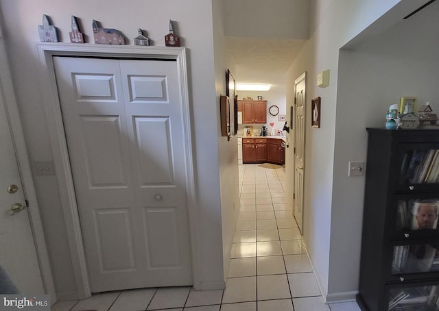 hallway featuring light tile flooring