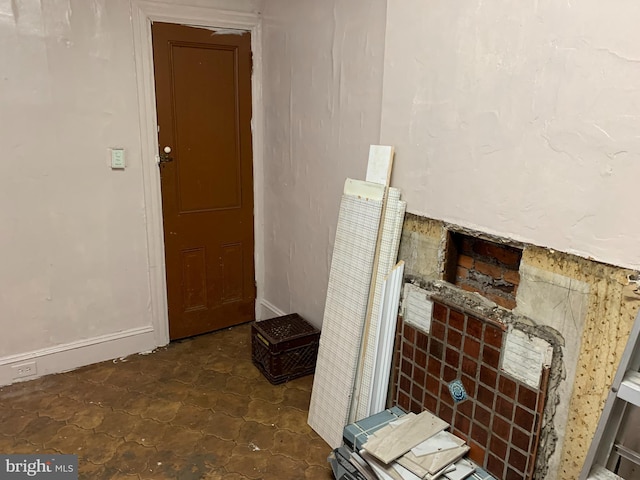 interior space featuring dark tile floors