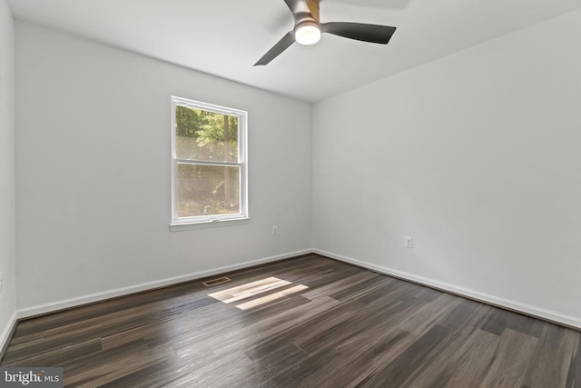 unfurnished room with ceiling fan and dark hardwood / wood-style floors