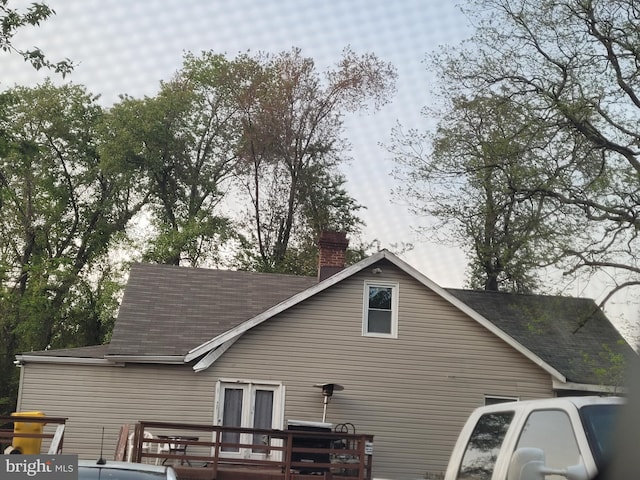 exterior space featuring a wooden deck and french doors