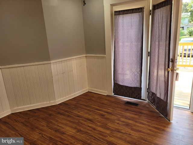 entrance foyer with dark hardwood / wood-style floors