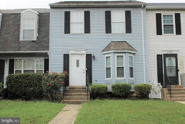 view of property with a front lawn