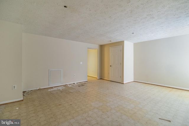 empty room with a textured ceiling