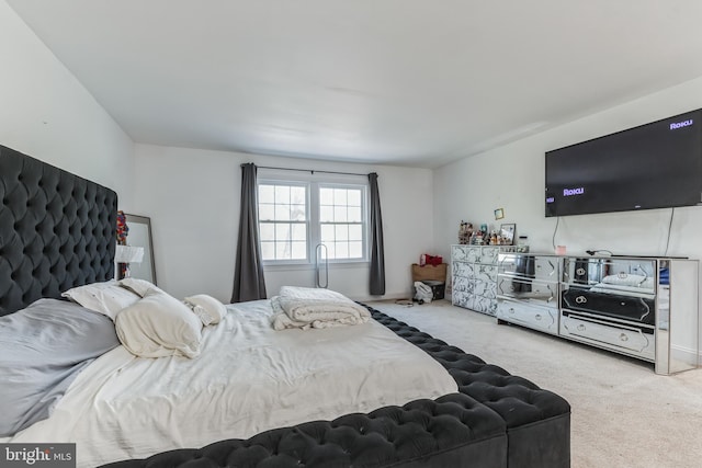 bedroom with light colored carpet