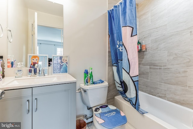 full bathroom featuring oversized vanity, shower / tub combo, and toilet